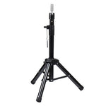 Representative image of a black adjustable tripod wig stand; exact fittings may vary